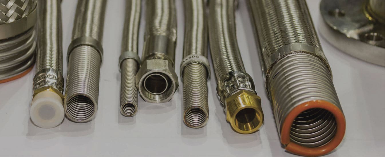 Metal expansion joints for industrial piping systems